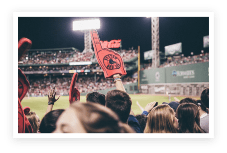 A crowd of people at a baseball game.